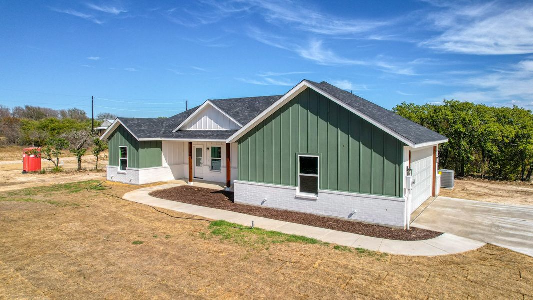 Representative exterior photo of a completed home built from the Lucas by Zeal Home Builders in Echo Grove, Poolville, TX (Image 40).