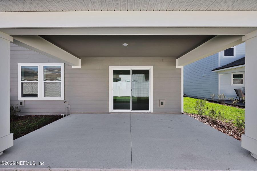 Front exterior of a new home in Wells Landing, Jacksonville, FL, highlighting curb appeal (Image 2). Front exterior of a new home in Wells Landing, Jacksonville, FL, highlighting curb appeal (Image 2).