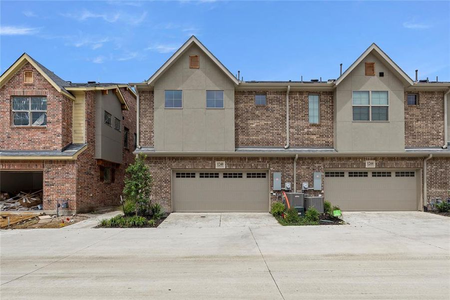 Front exterior of a new home in The Tribute, The Colony, TX, highlighting curb appeal (Image 1). Front exterior of a new home in The Tribute, The Colony, TX, highlighting curb appeal (Image 1).