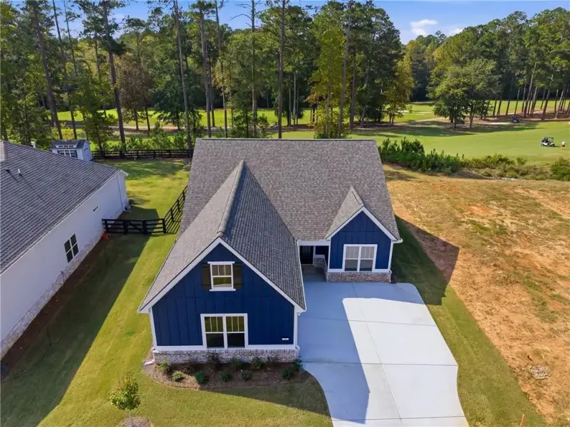 Front exterior of a new home in Heritage Pointe at The Georgian, Villa Rica, GA, highlighting curb appeal (Image 16). Front exterior of a new home in Heritage Pointe at The Georgian, Villa Rica, GA, highlighting curb appeal (Image 16).