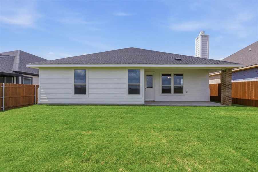 Expansive green lawn with a white horizontal siding exterior Expansive green lawn with a white horizontal siding exterior