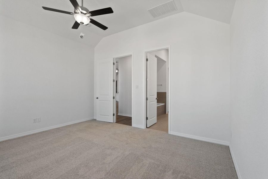 Primary Bedroom with elevated ceiling Primary Bedroom with elevated ceiling