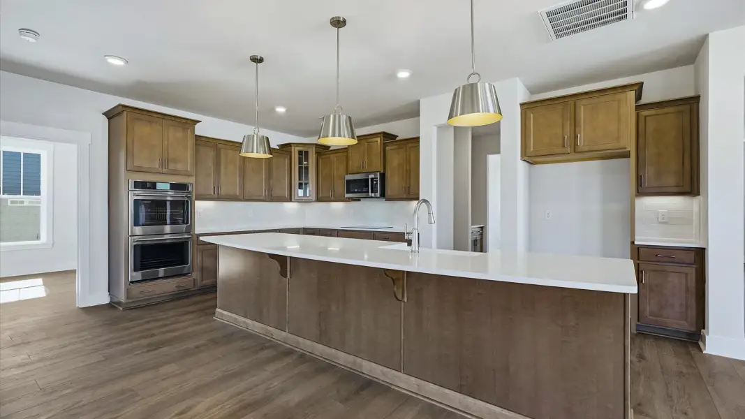 Vibrant kitchen layout with a center island, refined finishes, and open-concept flow in Woodruff, SC Vibrant kitchen layout with a center island, refined finishes, and open-concept flow in Woodruff, SC