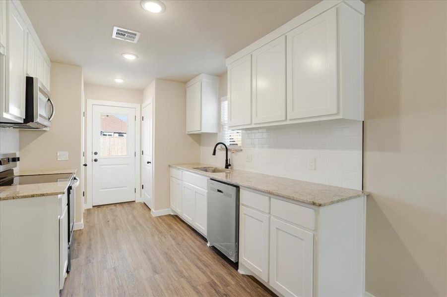 Furnished interior view inside a new home in Miller Street Cottages, Denison (Image 5).