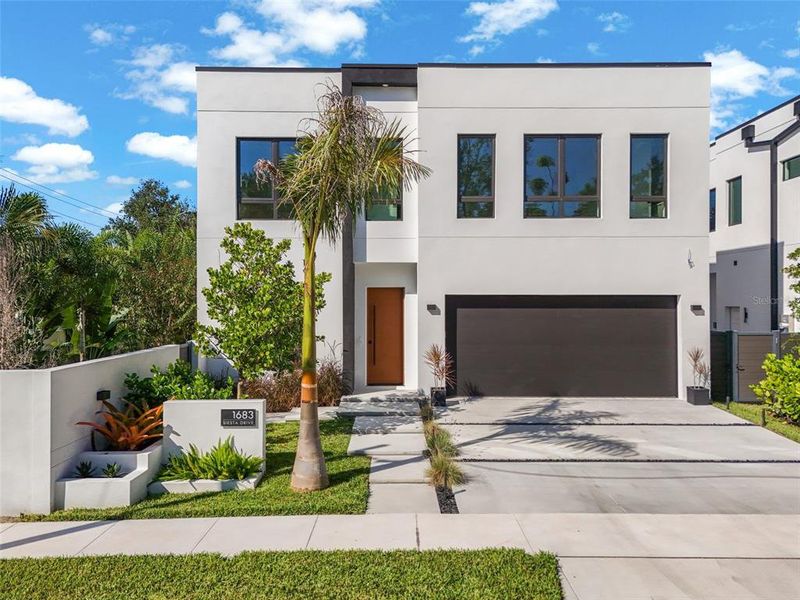 Front exterior of a new home in , Sarasota, FL, highlighting curb appeal (Image 2). Front exterior of a new home in , Sarasota, FL, highlighting curb appeal (Image 2).