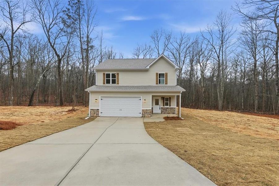 Front exterior of a new home in , Carrollton, GA, highlighting curb appeal (Image 26).