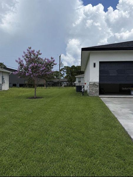 Front exterior of a new home in , Palm Bay, FL, highlighting curb appeal (Image 18).