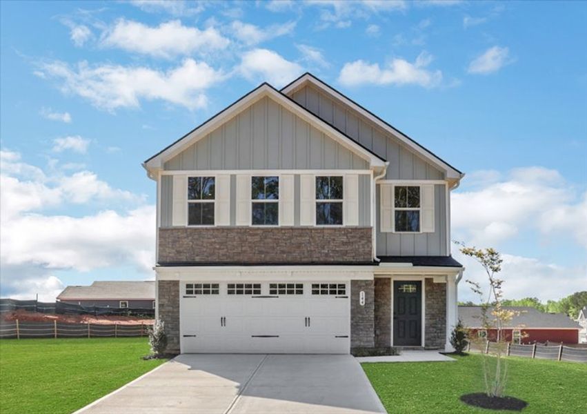 Front exterior of a new home in Aspen Meadows, Hampton, GA, highlighting curb appeal (Image 1). Front exterior of a new home in Aspen Meadows, Hampton, GA, highlighting curb appeal (Image 1).