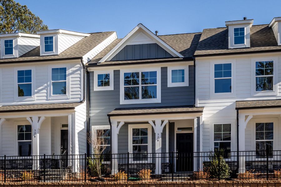 Front exterior of a new home in Enclave at Traditions Townhomes, Wake Forest, NC, highlighting curb appeal (Image 2). Front exterior of a new home in Enclave at Traditions Townhomes, Wake Forest, NC, highlighting curb appeal (Image 2).