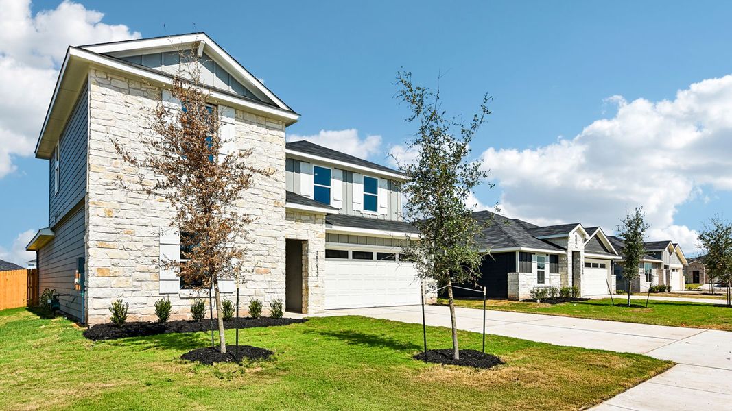 Front exterior of a new home in Monarch Ranch, Manor, TX, highlighting curb appeal (Image 2).