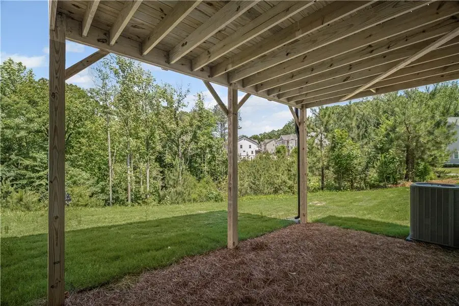 Exterior details and patio area of a home in The Retreat at River Green, Canton (Image 26).