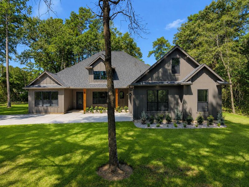 Front exterior of a new home in , Plantersville, TX, highlighting curb appeal (Image 1). Front exterior of a new home in , Plantersville, TX, highlighting curb appeal (Image 1).
