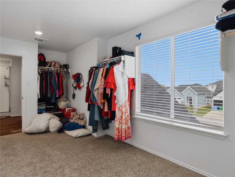 Plentiful natural light streams through a large window illuminating this versatile dressing area. Plentiful natural light streams through a large window illuminating this versatile dressing area.