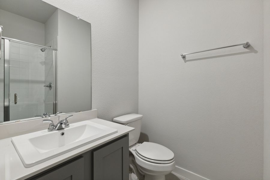 Bathroom in the Oscar home plan by Trophy Signature Homes – REPRESENTATIVE PHOTO