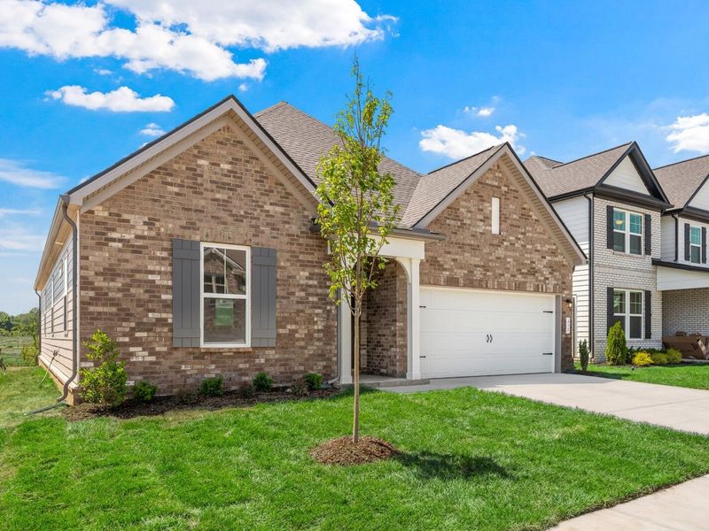 Front exterior of a new home in Woods Crossing, Gallatin, TN, highlighting curb appeal (Image 23).