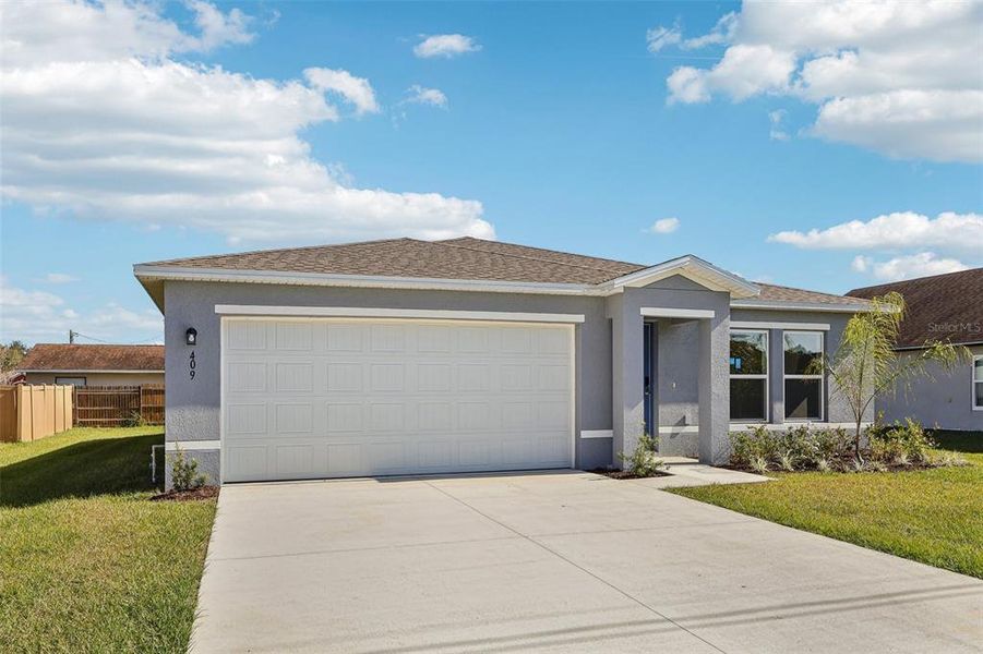Front exterior of a new home in Stone Ridge, Sebring, FL, highlighting curb appeal (Image 6).