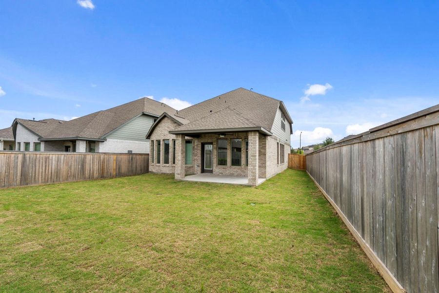 Exterior details and patio area of a home in Bridgeland, Cypress (Image 4).