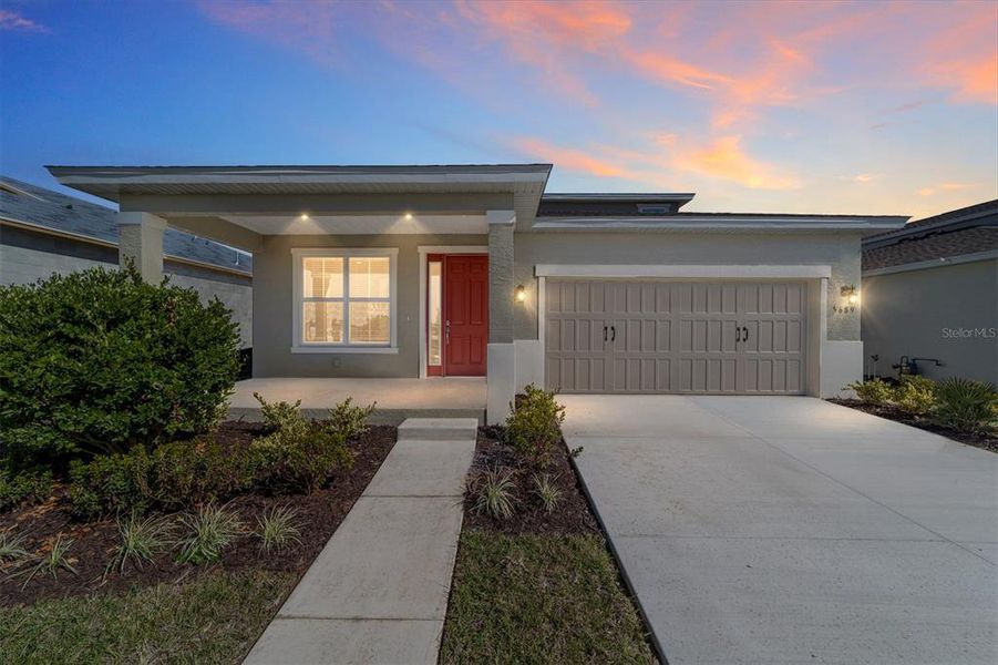 Front exterior of a new home in Calesa Township, Ocala, FL, highlighting curb appeal (Image 2).