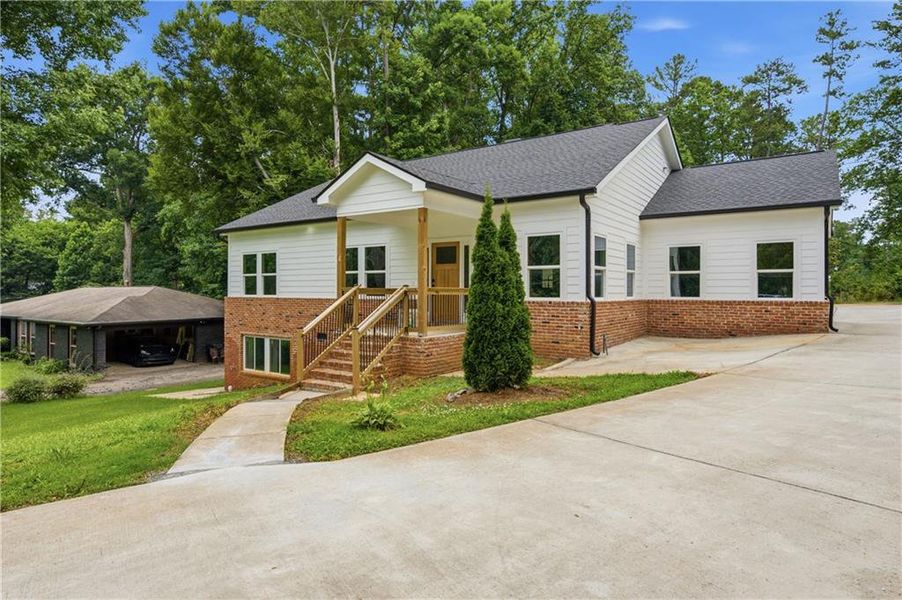 Front exterior of a new home in , East Point, GA, highlighting curb appeal (Image 1). Front exterior of a new home in , East Point, GA, highlighting curb appeal (Image 1).