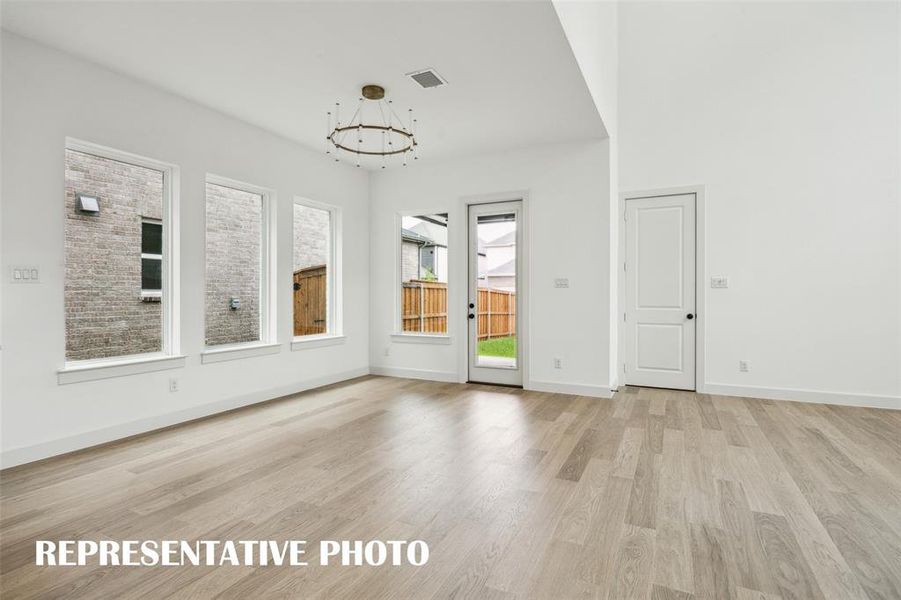 With a spacious dining room and easy access to the lovely covered back patio, it's easy to dine inside or out in this beautiful home  REPRESENTATIVE PHOTO