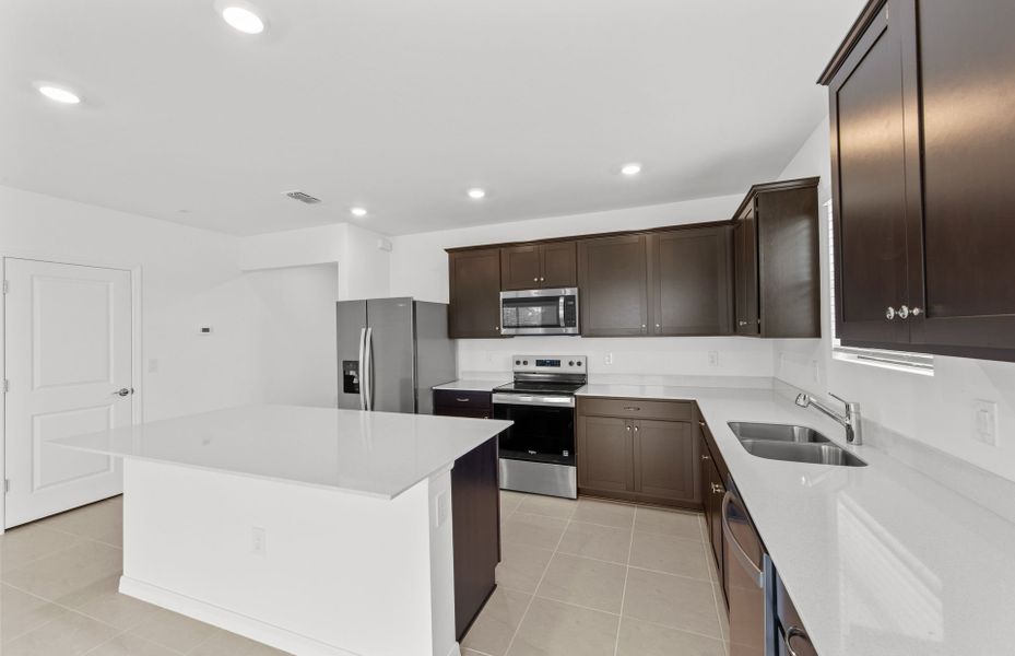 Furnished interior view inside a new home in Whispering Lakes, Lehigh Acres (Image 14).