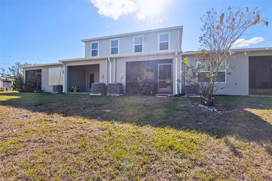 Exterior details and patio area of a home in Anclote Square, Holiday (Image 24).