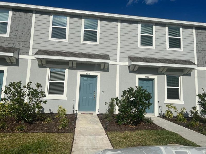 Front exterior of a new home in , Kissimmee, FL, highlighting curb appeal (Image 2). Front exterior of a new home in , Kissimmee, FL, highlighting curb appeal (Image 2).