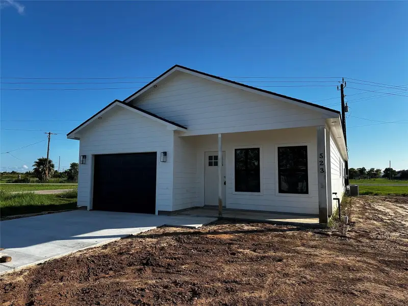 Front exterior of a new home in , Freeport, TX, highlighting curb appeal (Image 2). Front exterior of a new home in , Freeport, TX, highlighting curb appeal (Image 2).