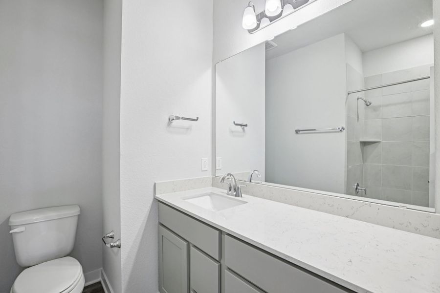 A bathroom with a glass shower.