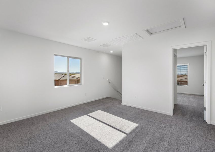 A large upstairs game room highlights this home.
