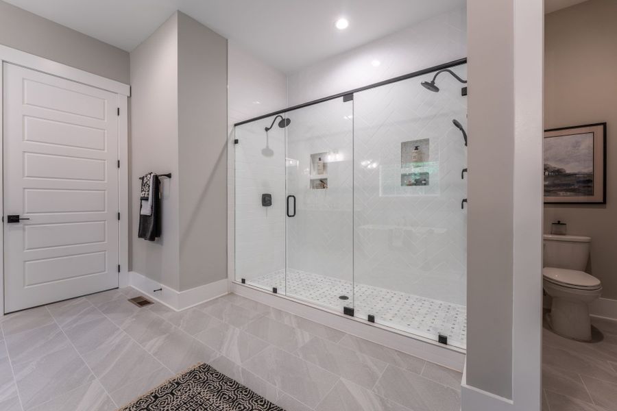 32. HHHunt Homes Crawford- First Floor Primary Bathroom 8 ' shower close up