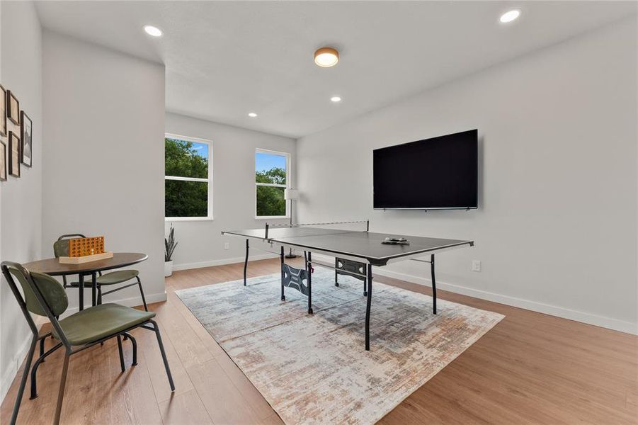 Game room with recessed lighting and light wood-type flooring Game room with recessed lighting and light wood-type flooring