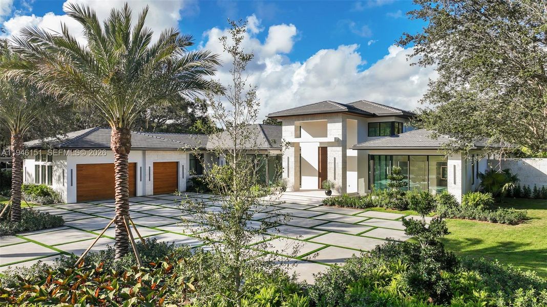 Front exterior of a new home in , Pinecrest, FL, highlighting curb appeal (Image 2).