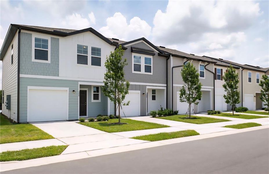 Front exterior of a new home in Temples Crossing, Davenport, FL, highlighting curb appeal (Image 1). Front exterior of a new home in Temples Crossing, Davenport, FL, highlighting curb appeal (Image 1).