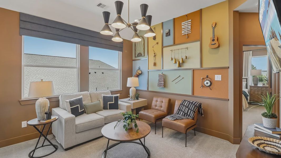 Furnished interior view inside a new home in Meridiana Chateau, Manvel (Image 9).
