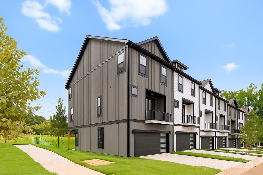 Front exterior of a new home in , Charlotte, NC, highlighting curb appeal (Image 1).