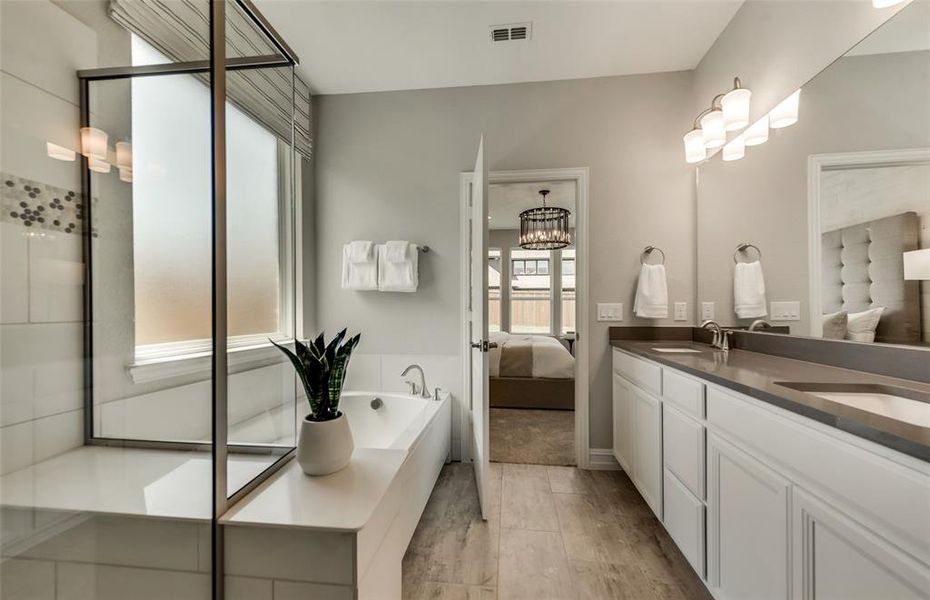 Owner's bathroom with oversized shower *Photos of furnished model. Not actual home. Representative of floor plan. Some options and features may vary.