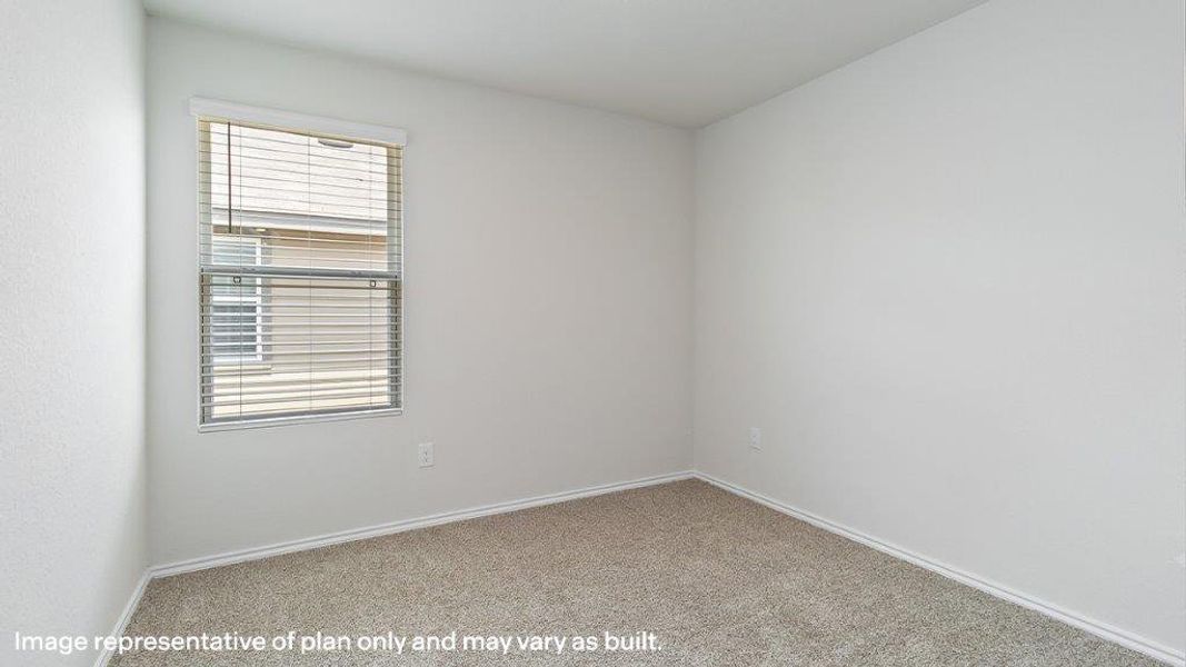 Well-lit and versatile, this bedroom features carpet flooring and a single window with blinds. Well-lit and versatile, this bedroom features carpet flooring and a single window with blinds.