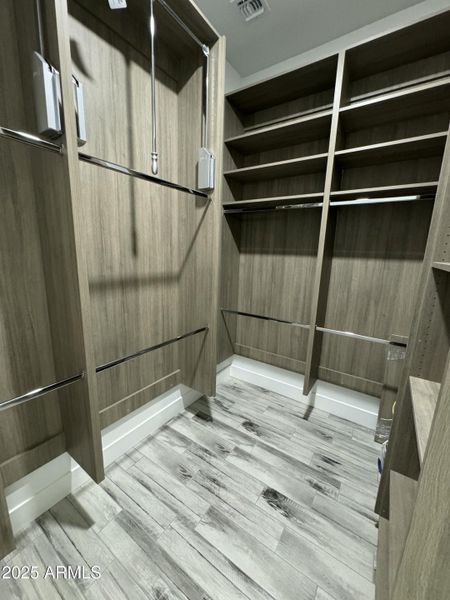 Master closet with pull down wardrobe