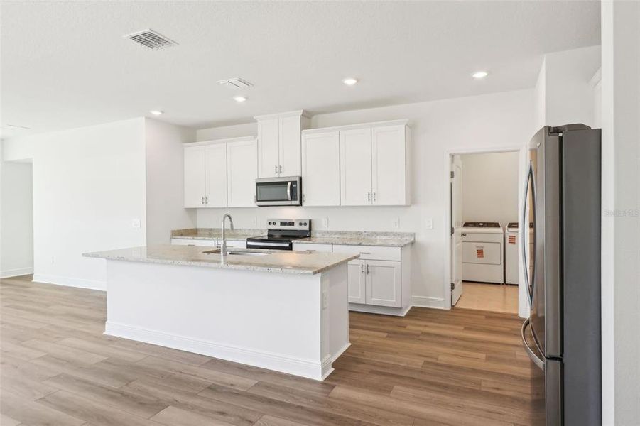 Furnished interior view inside a new home in Cyrene at Minneola - Villas, Minneola (Image 9).