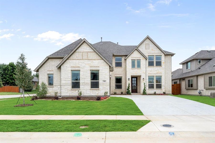 Front exterior of a new home in Glenwood Meadows, Argyle, TX, highlighting curb appeal (Image 22). Front exterior of a new home in Glenwood Meadows, Argyle, TX, highlighting curb appeal (Image 22).
