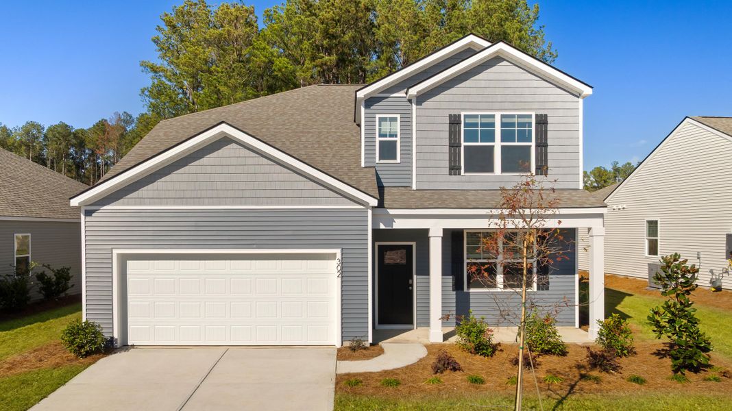 Front exterior of a new home in Pine Hills at Cane Bay, Summerville, SC, highlighting curb appeal (Image 2).