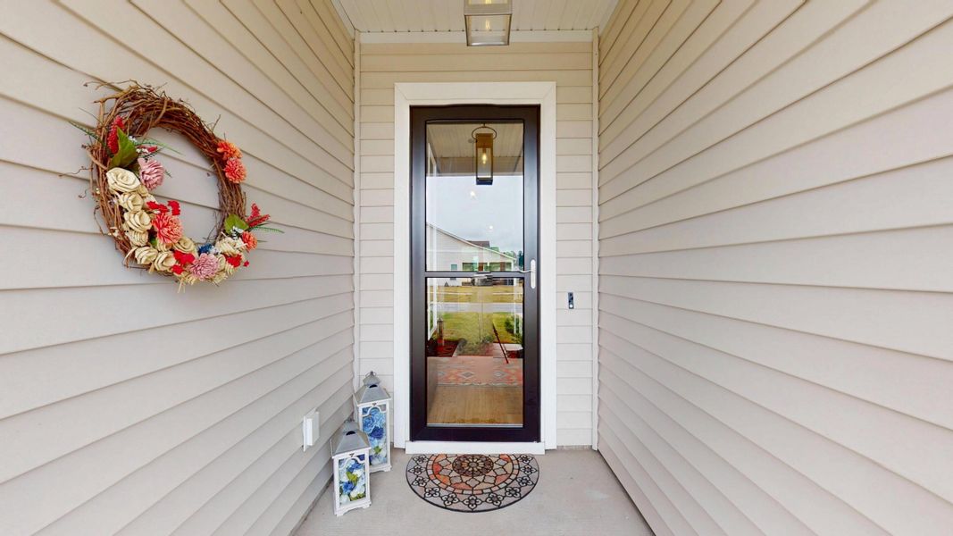 Exterior details and patio area of a home in Summerwind Crossing at Lakes of Cane Bay, Summerville (Image 3).