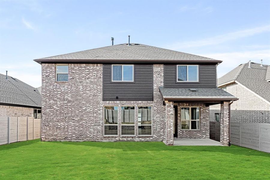 Front exterior of a new home in Painted Tree Woodland District 50, McKinney, TX, highlighting curb appeal (Image 23).