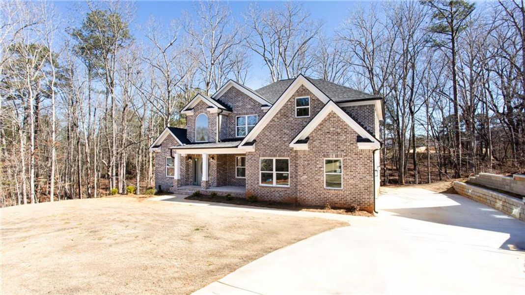 Front exterior of a new home in , McDonough, GA, highlighting curb appeal (Image 26).