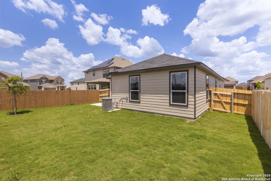 Front exterior of a new home in Woodside Farms, Seguin, TX, highlighting curb appeal (Image 1).
