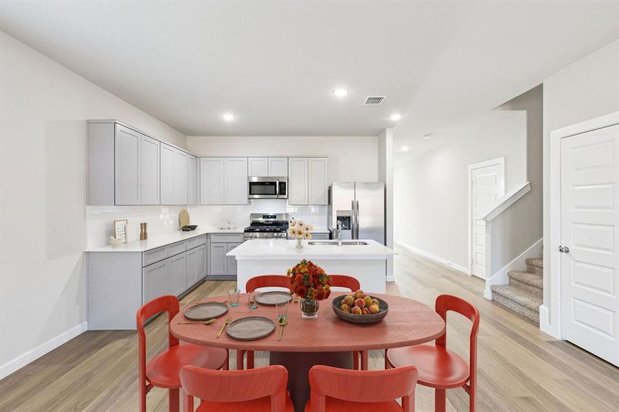 Kitchen in the Haylee home plan by Trophy Signature Homes - REPRESENTATIVE PHOTO