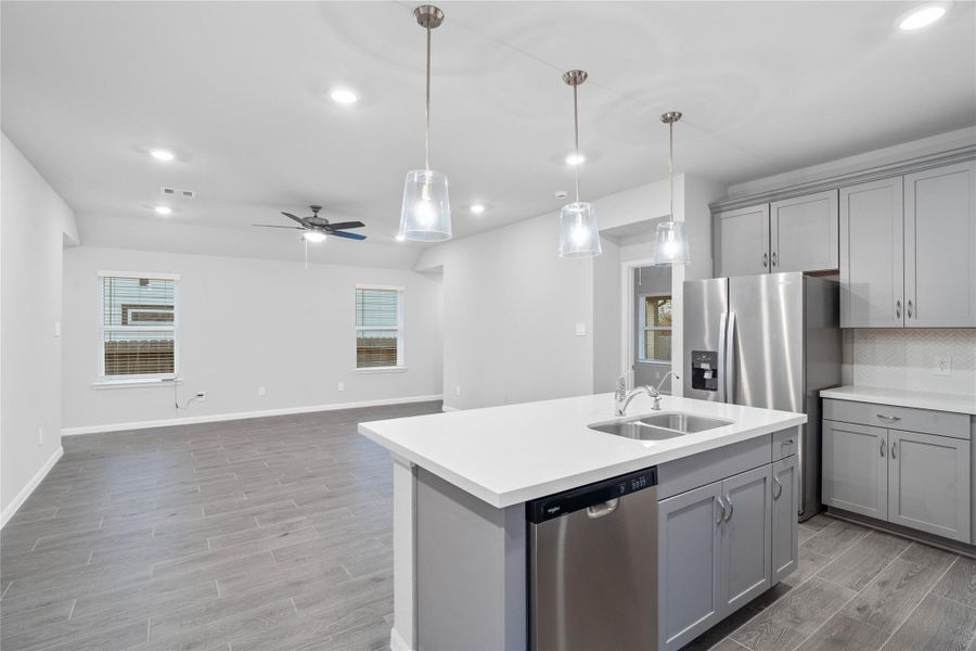 From the expansive kitchen island, enjoy seamless sightlines across the open-concept living area, making entertaining a breeze and ensuring you're never far from the conversation.