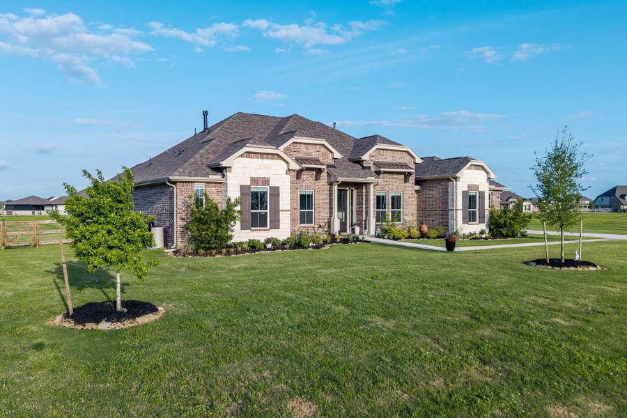 Front exterior of a new home in Lakeview, Waller, TX, highlighting curb appeal (Image 21).