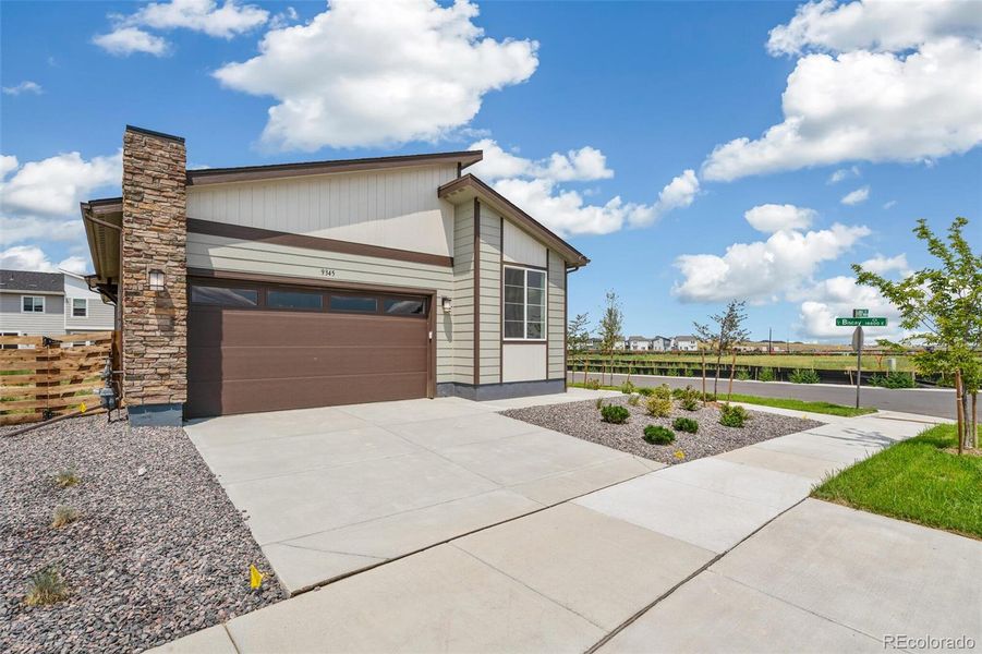Front exterior of a new home in Legato, Commerce City, CO, highlighting curb appeal (Image 19).